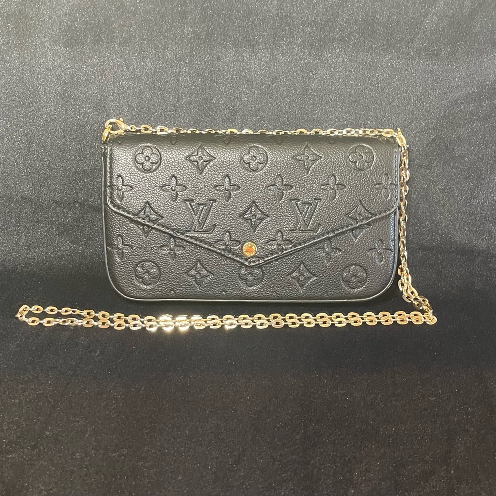 Black and Gold Monogram Clutch
Luxury Inpaired